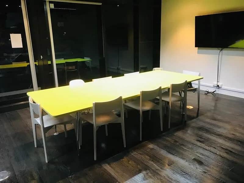 Clean corporate boardroom with long table